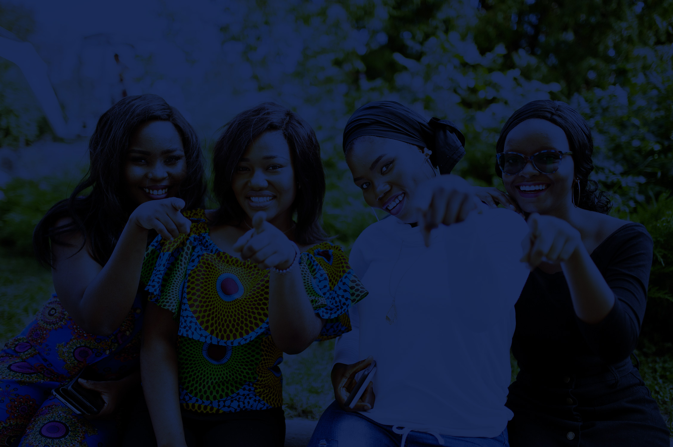 #group-four-african-american-girls-sitting-outdoor-showing-fingers